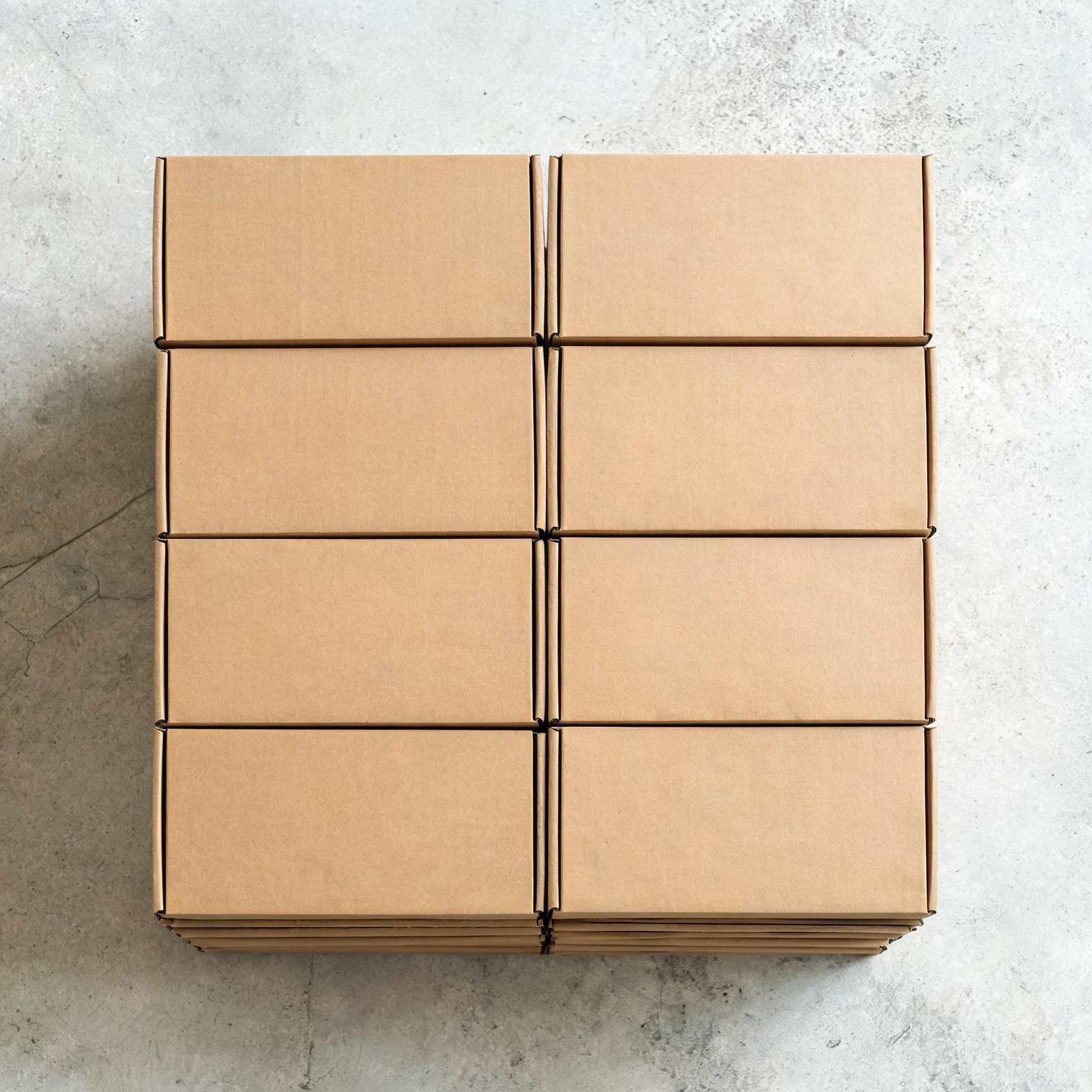 Cardboard shipping boxes seen from above on a concrete floor